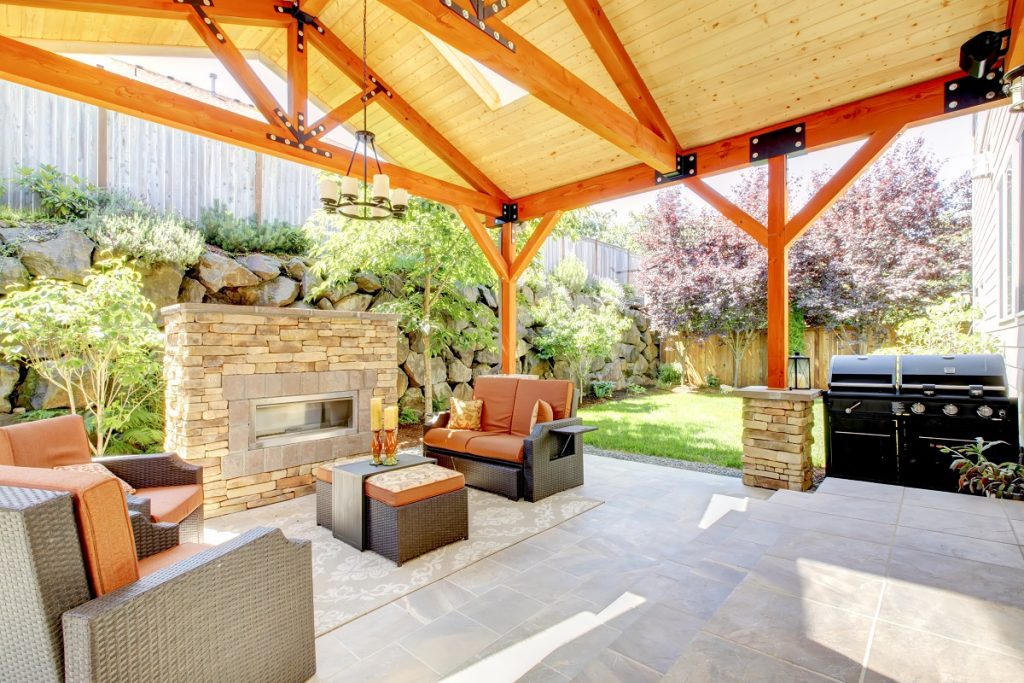 Covered patio with a fireplace