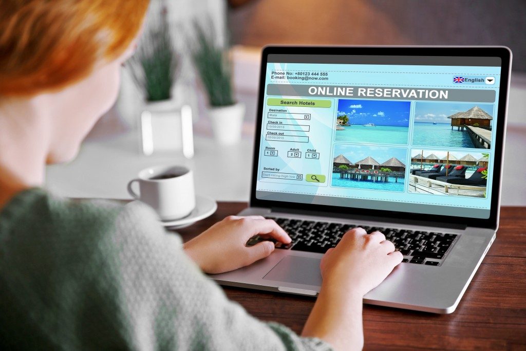 woman booking a hotel accommodation online