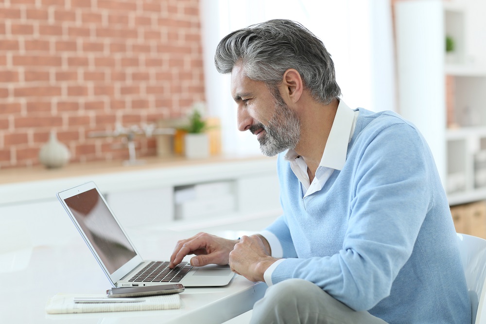 man using laptop