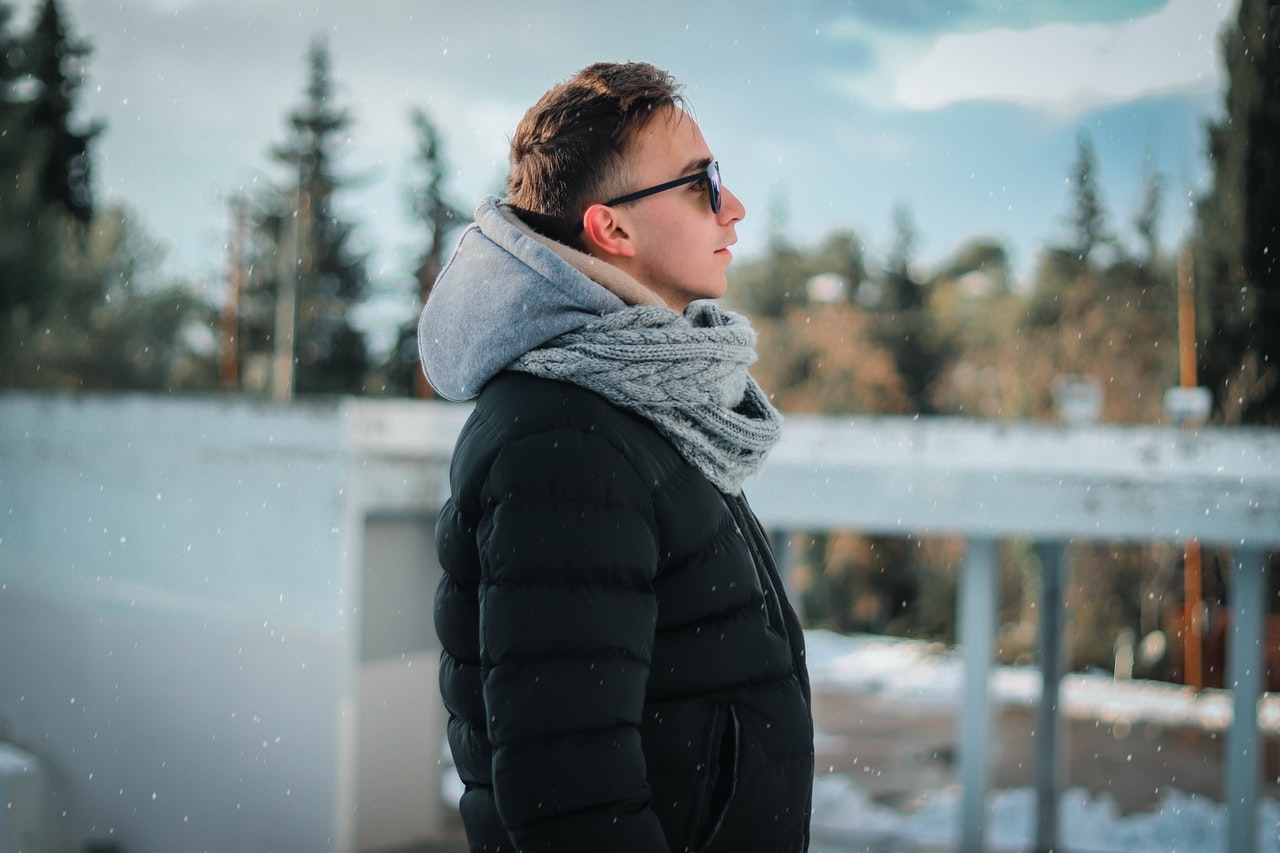 person standing outside with thick clothes