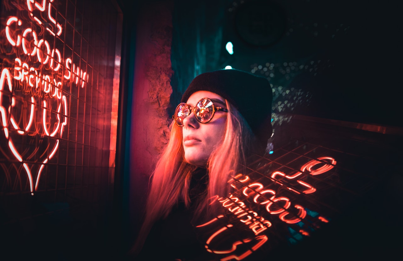 woman looking at neon sign