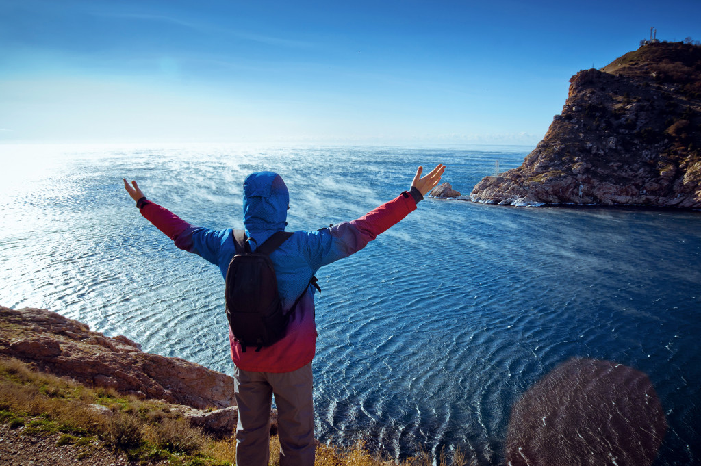 man standing near the ocean