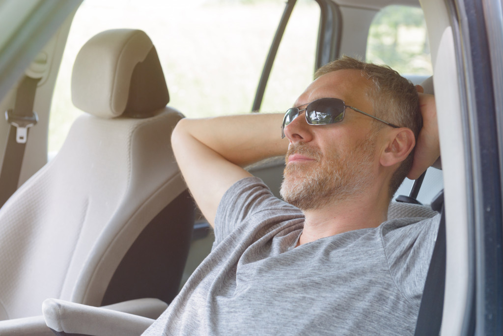 Driver rests while sitting in the driver's seat