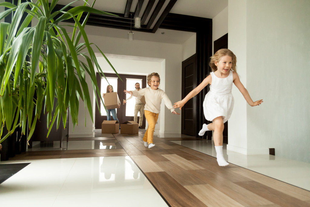 excited kids running in their house